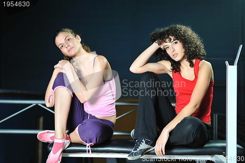 Image of two women work out  in fitness club