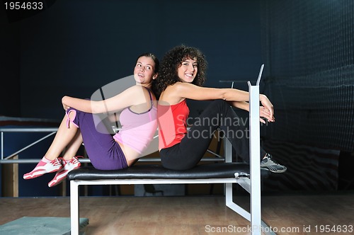 Image of two women work out  in fitness club