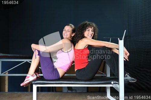 Image of two women work out  in fitness club