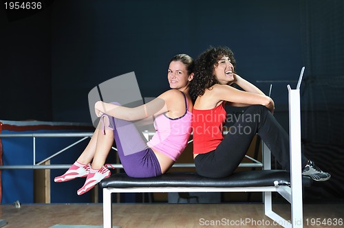 Image of two women work out  in fitness club