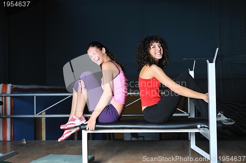 Image of two women work out  in fitness club