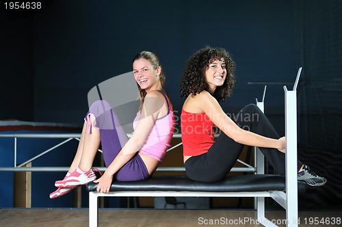 Image of two women work out  in fitness club