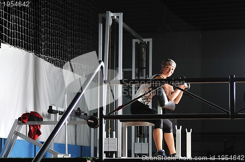 Image of young woman practicing fitness and working out