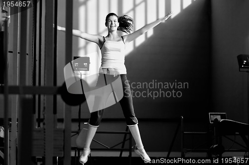 Image of one young happy  woman jump