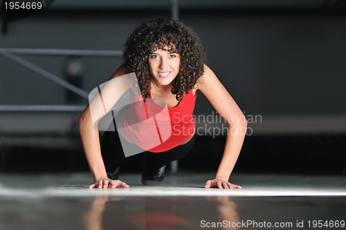 Image of young woman practicing fitness and working out