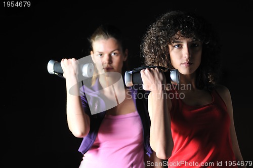 Image of two women work out  in fitness club