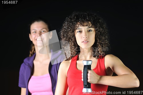 Image of two women work out  in fitness club