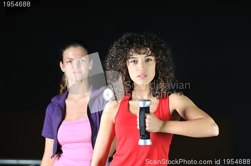 Image of two women work out  in fitness club