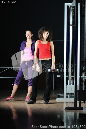 Image of two women work out  in fitness club