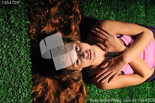 Image of young woman relax on green stairs with grass surface