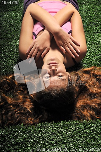 Image of young woman relax on green stairs with grass surface