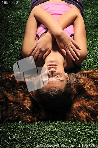 Image of young woman relax on green stairs with grass surface