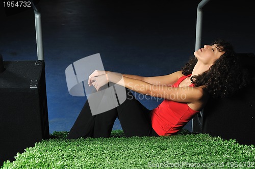 Image of young woman relax on green stairs with grass surface
