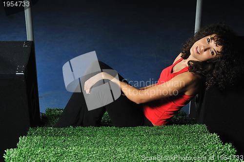 Image of young woman relax on green stairs with grass surface