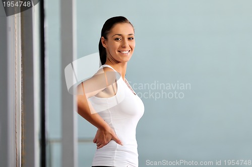 Image of young woman practicing fitness and working out