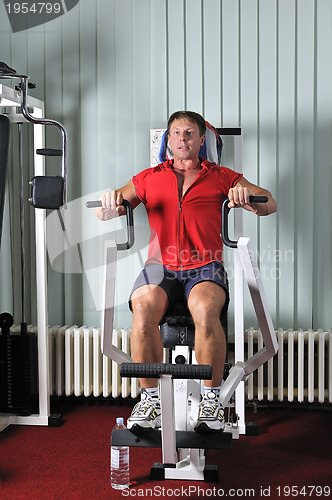 Image of Strong  man work out in gym