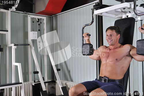 Image of Strong  man work out in gym