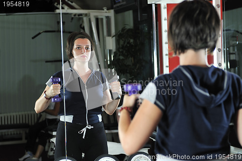 Image of young  woman work out in fitness