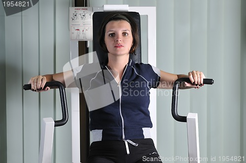 Image of young  woman work out in fitness