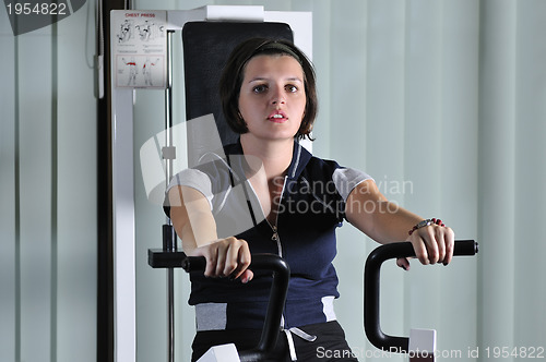 Image of young  woman work out in fitness