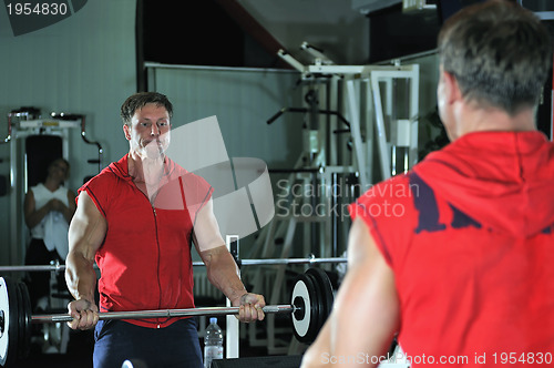 Image of Strong  man work out in gym