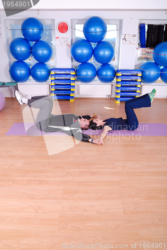 Image of .happy couple at gym working out