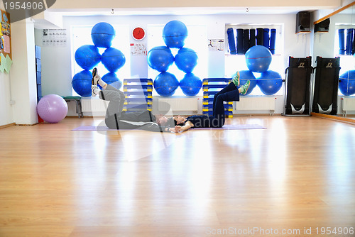 Image of .happy couple at gym working out