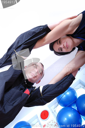 Image of .happy couple recreating in fitness studio