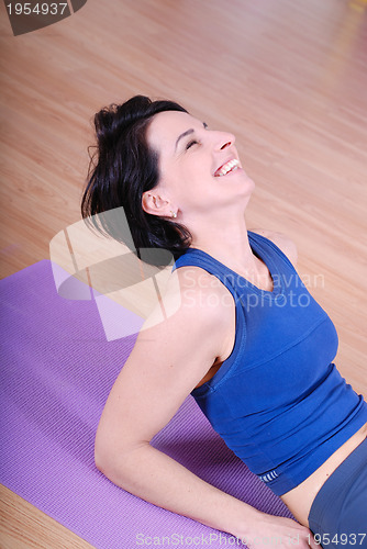 Image of young and healthy woman in fitness club