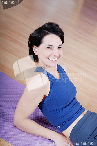 Image of young and healthy woman in fitness club