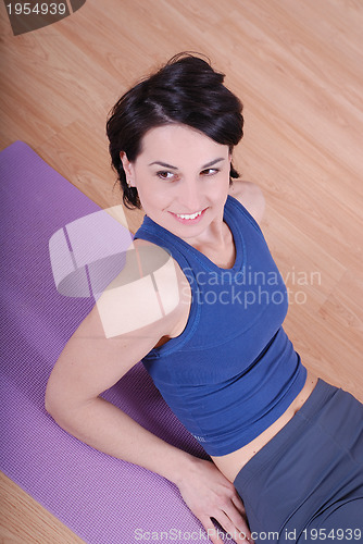 Image of young and healthy woman in fitness club