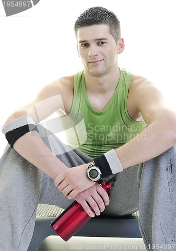 Image of sportsman relaxing and drinking water