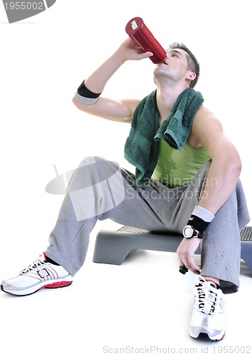 Image of sportsman relaxing and drinking water