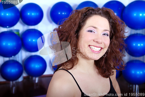 Image of happy girl in fitness studio