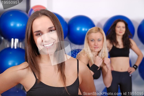 Image of happy girl in fitness studio