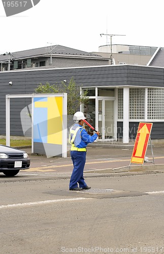 Image of Man directing traffic 2