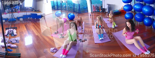 Image of teamwork in fitness studio