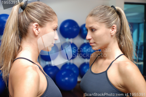 Image of a young model working out in fitness studio