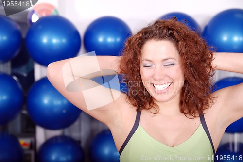 Image of happy girl in fitness studio