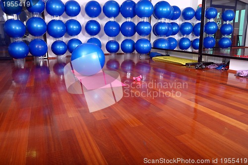 Image of fitness studio with blue pilates balls