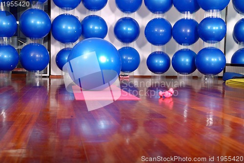 Image of fitness studio with blue pilates balls