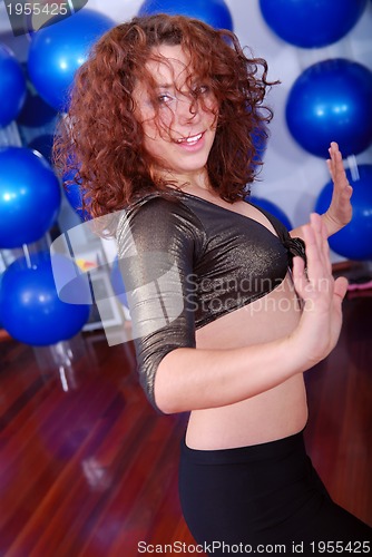 Image of happy girl in fitness studio