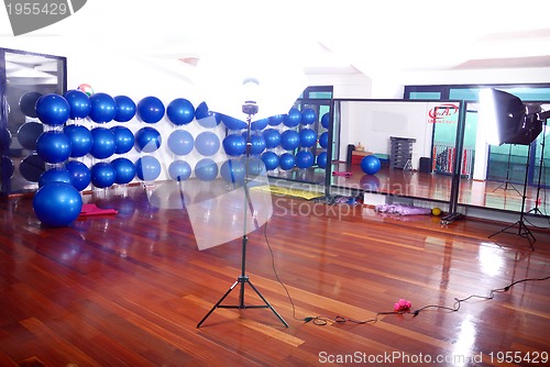 Image of fitness studio with blue pilates balls