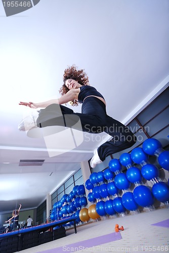 Image of Dancing woman, happy and jumping up.