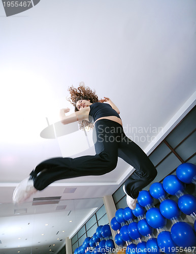 Image of Dancing woman, happy and jumping up.