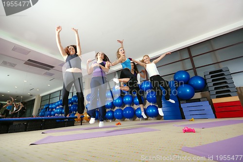 Image of Happy young girls jumping high