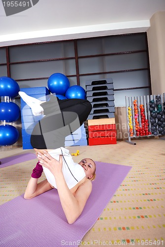 Image of health club: women doing stretching and aerobics