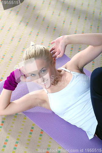 Image of woman exercise in a fitness center