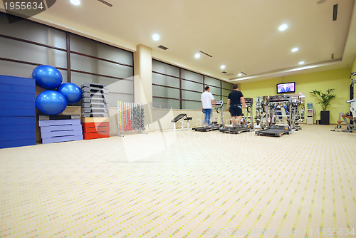 Image of Man running on treadmill in gym