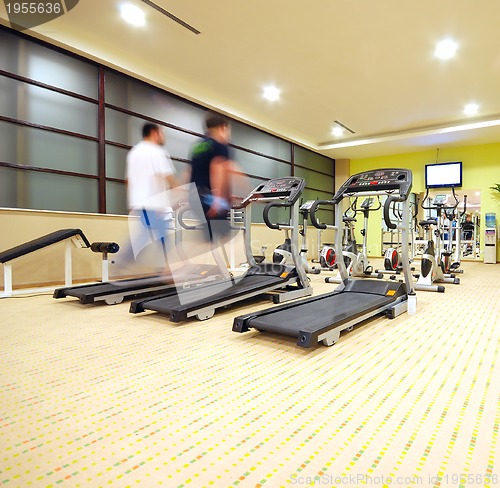 Image of Man running on treadmill in gym